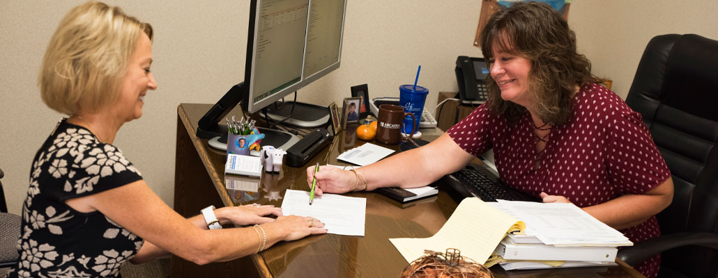 Reichley Insurance Agency agents Patti Drake and Liz Myers in the office